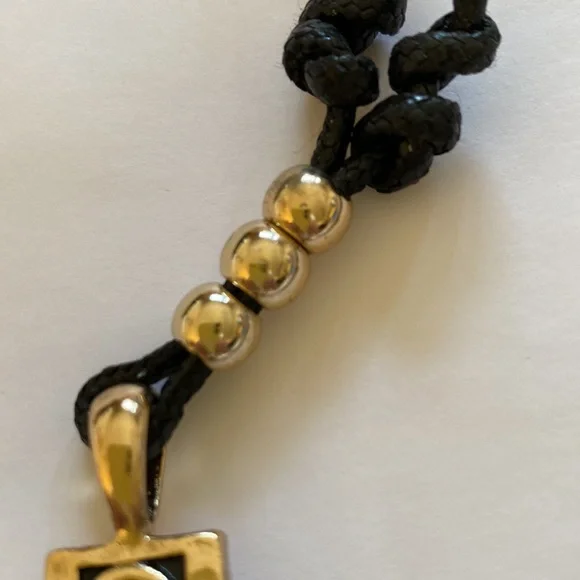 VINTAGE 1946 GOLD TONE CROSS ON BLACK CORD UNISEX NECKLACE - Picture 5 of 5